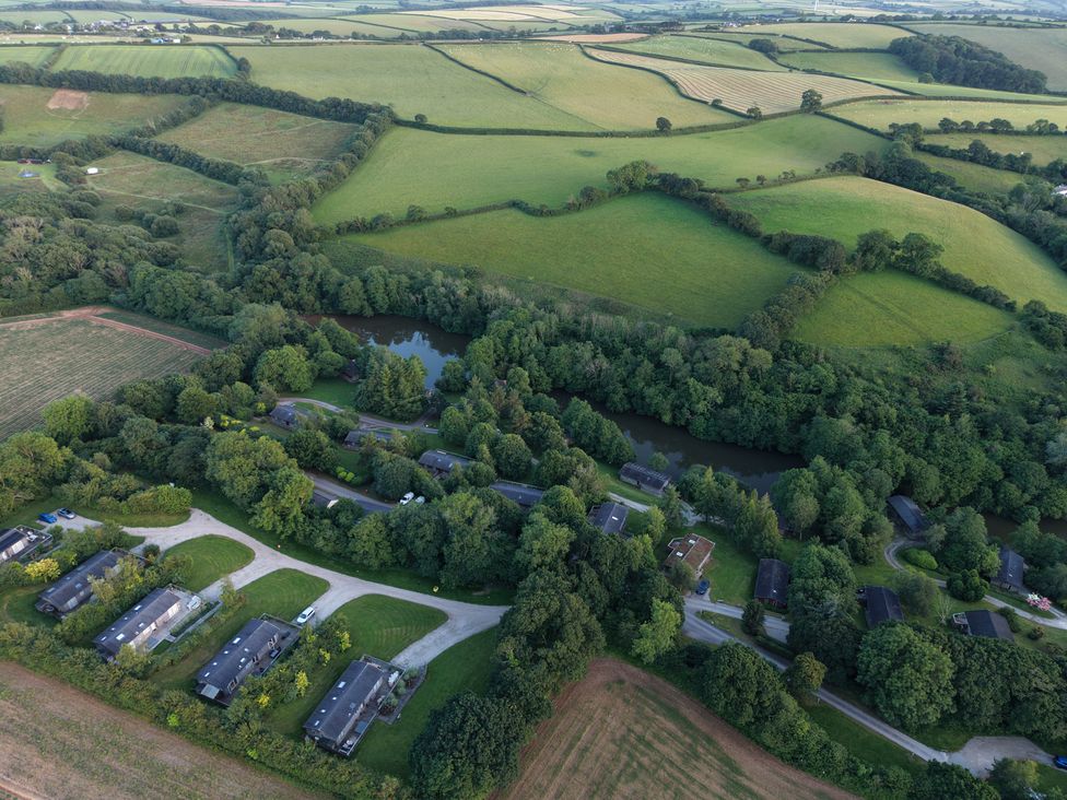 Aerial view of fields and houses at 1 Valley View in Lanreath