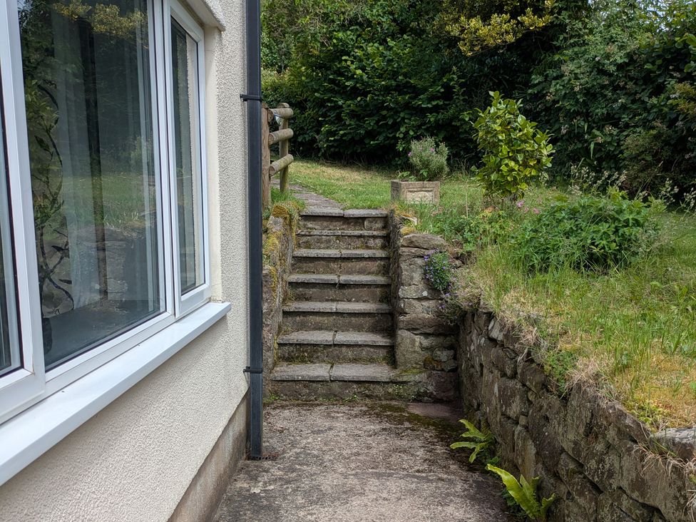 Steps leading to a garden area at Pool House The Narth near Trellech