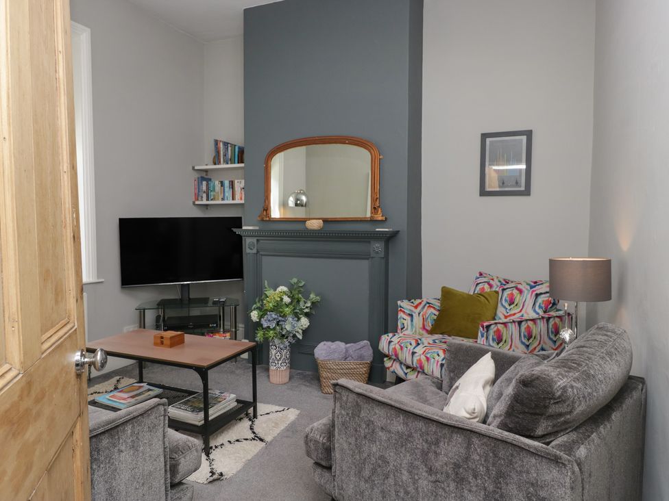 A living room with a television and sofa at Number Thirty-Nine in Ulverston