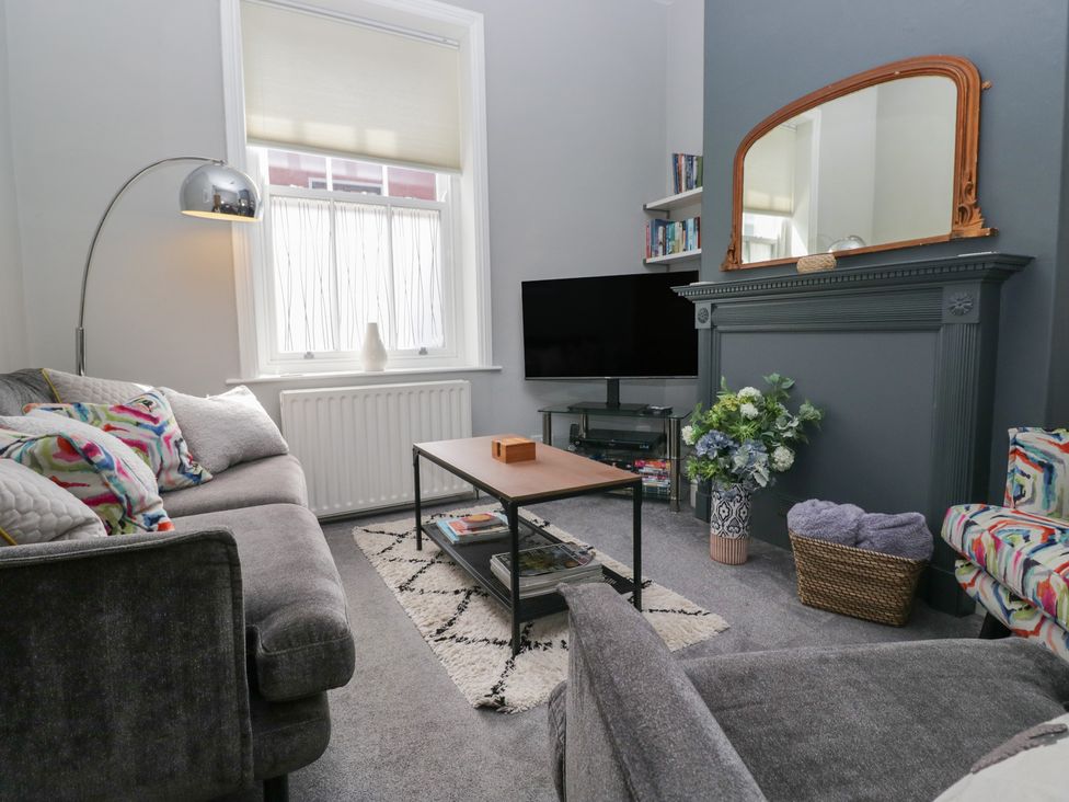 A living room with a sofa and television at Number Thirty-Nine in Ulverston
