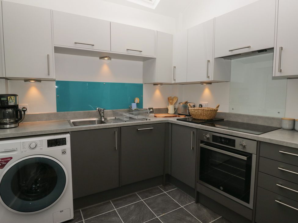 A kitchen with cabinets and appliances at Number Thirty-Nine Ulverston