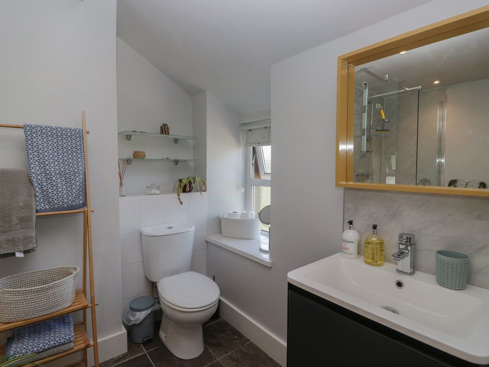 A bathroom with a toilet, sink, and shower at Number Thirty-Nine, Ulverston