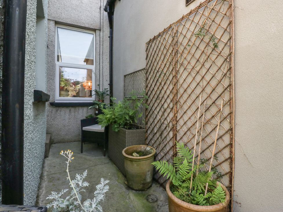 A garden area with plants and a trellis at Number Thirty-Nine in Ulverston