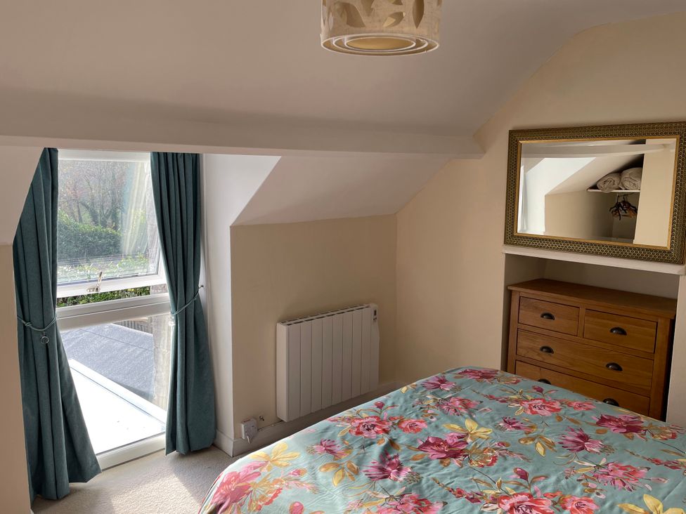 A bedroom with a bed and dresser at Willow Nook in Glaisdale near Lealholm