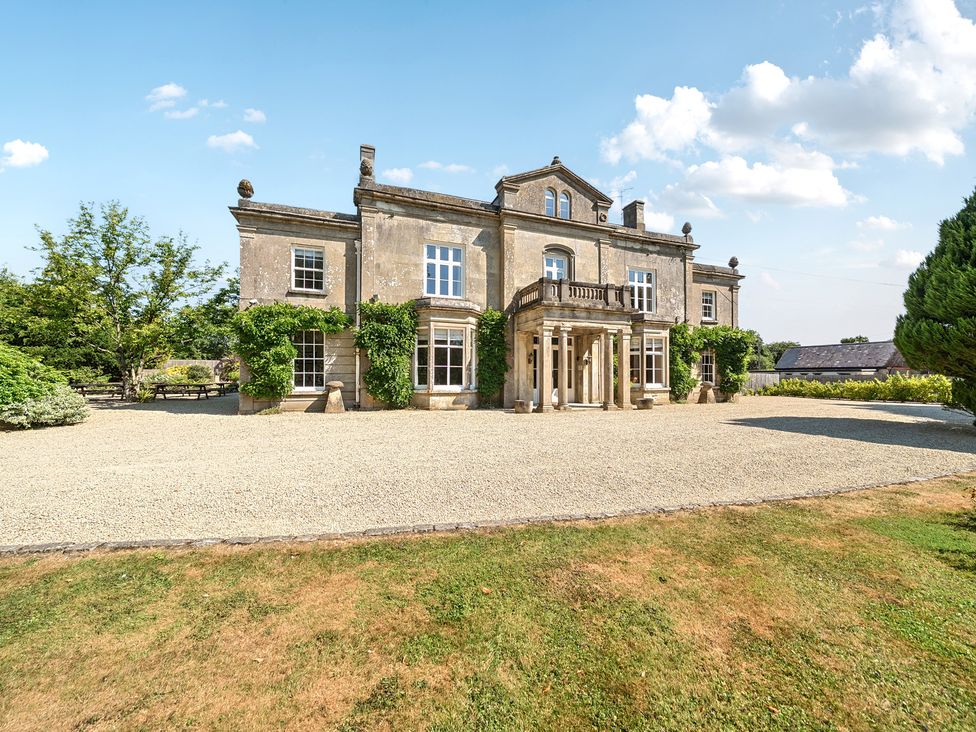 A house with windows and an entrance at Milton Manor in Milton On Stour