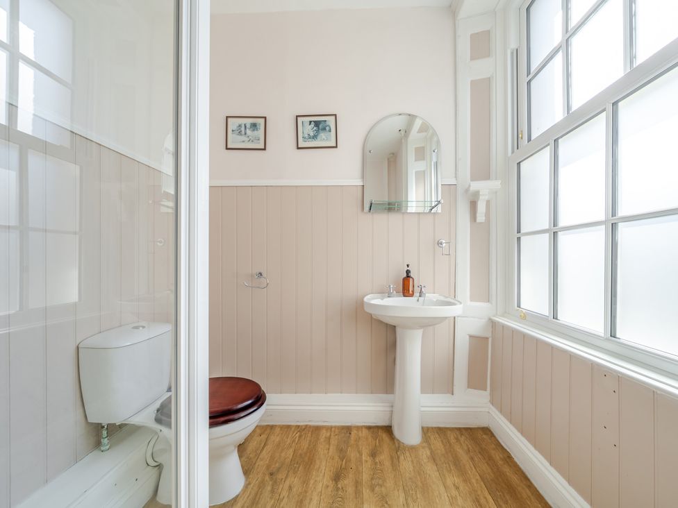 A bathroom with a sink and toilet at Milton Manor in Milton On Stour