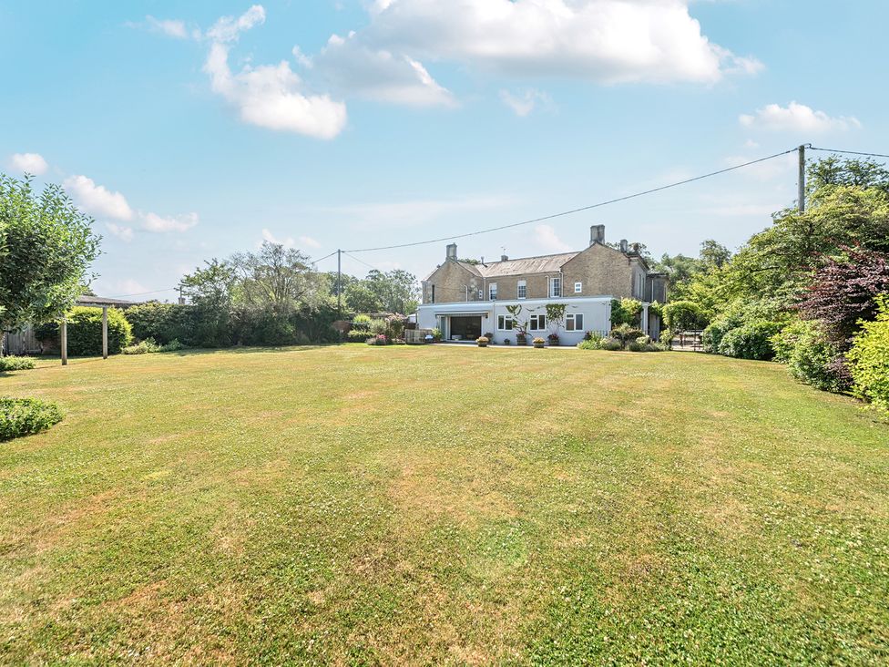 An outdoor view of a house with garden at Milton Manor in Milton On Stour