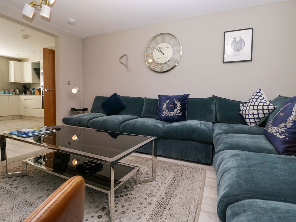 A living room with a sofa and coffee table at Bishop Fell in Newby Bridge