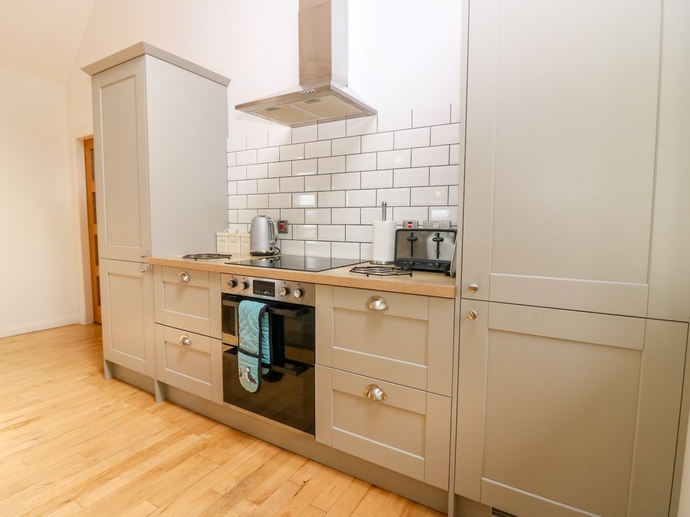 A kitchen with cabinets and appliances at Whitehouse Woodwrae near Forfar