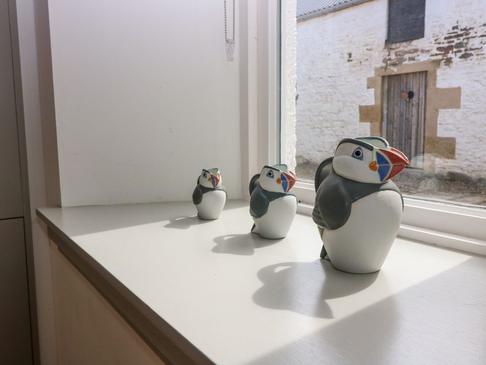 Puffin figurines on a windowsill at Whitehouse Woodwrae Aberlemno near Forfar