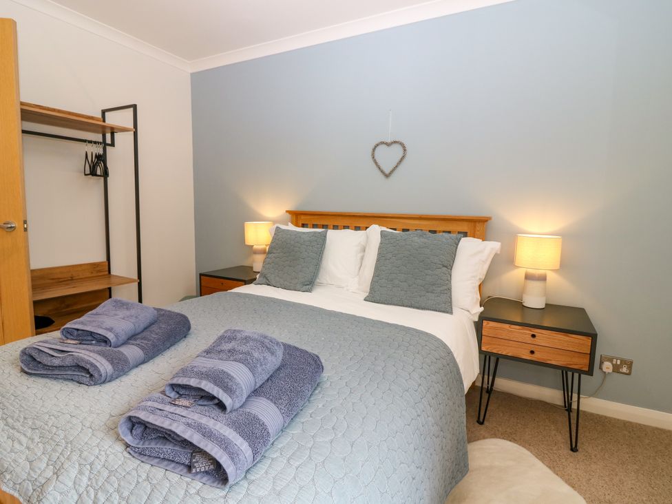 A bedroom with a bed and nightstand at Whitehouse Woodwrae Aberlemno near Forfar