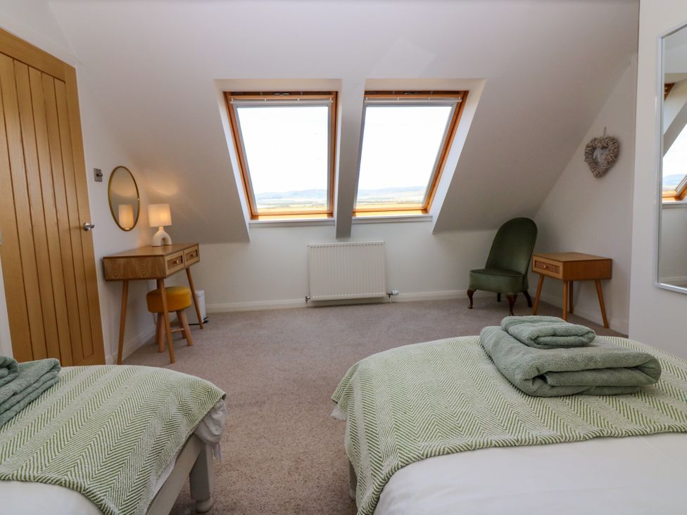 A bedroom with two beds and desk at Whitehouse Woodwrae Aberlemno near Forfar
