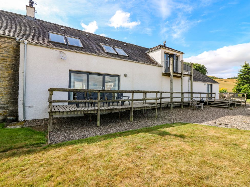An outdoor view of a house with a deck and balcony at Whitehouse Woodwrae Aberlemno near Forfar