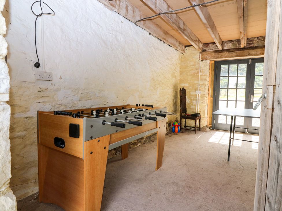 A game room with a foosball table and table at Whitehouse Woodwrae Aberlemno near Forfar