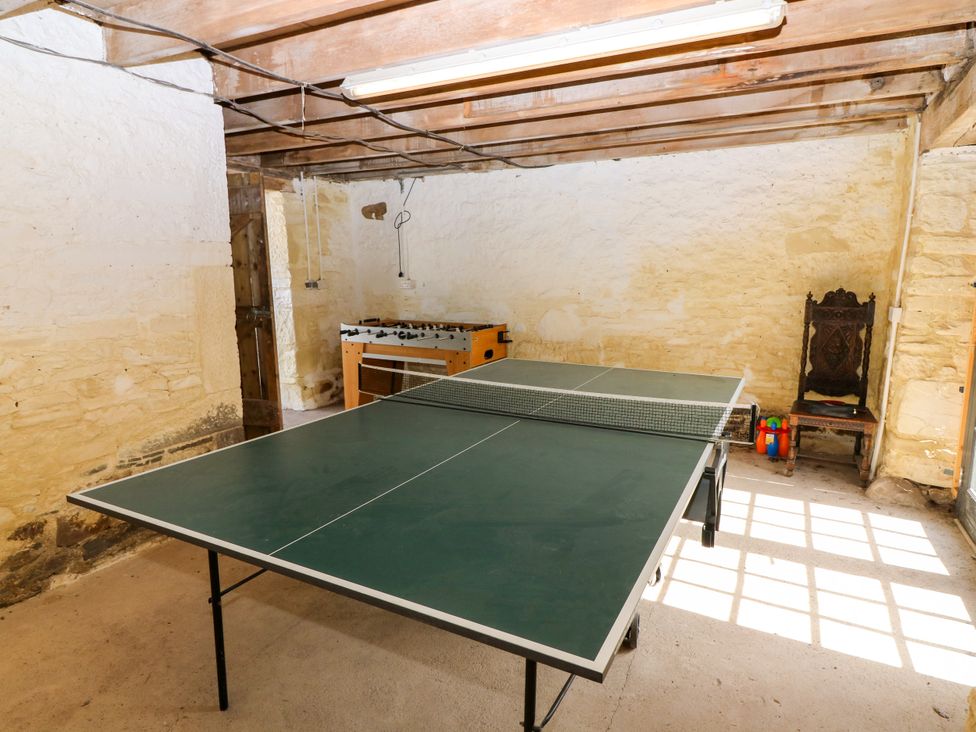 A recreation room with a ping pong table and a foosball table at Whitehouse Woodwrae Aberlemno near Forfar