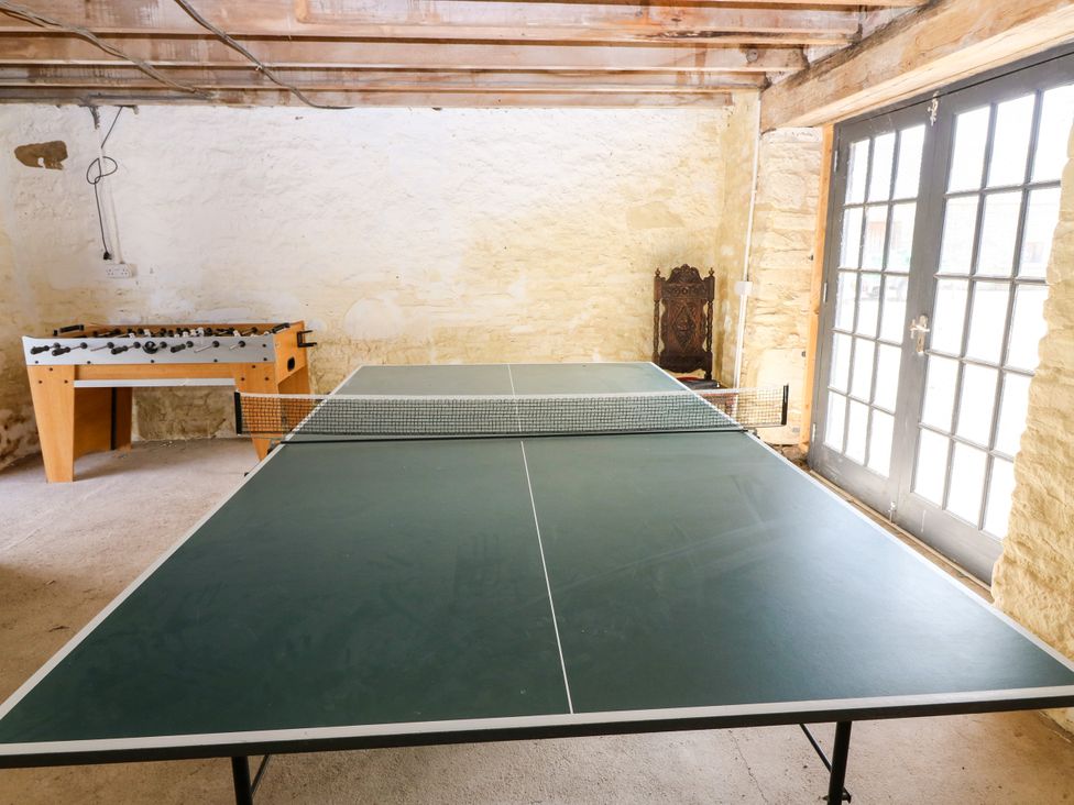 A game room with a foosball table and table tennis table at Whitehouse Woodwrae Aberlemno near Forfar