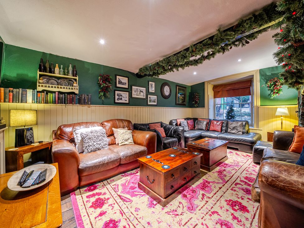 A living room with sofas and a coffee table at The Boars Head Pub in Bishop's Castle