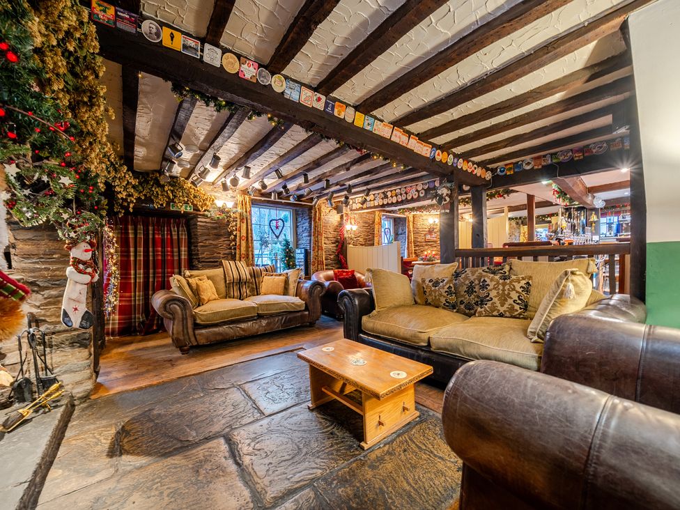 A living room with sofas and a coffee table at The Boars Head Pub in Bishop's Castle