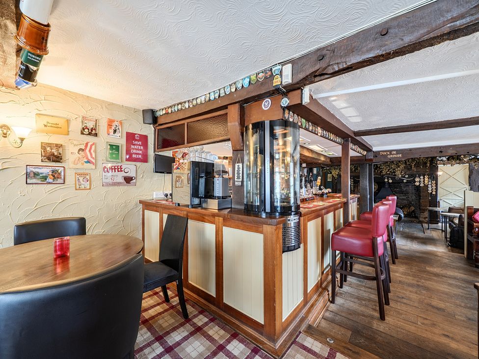 A bar and seating area at The Boars Head Pub in Bishop's Castle