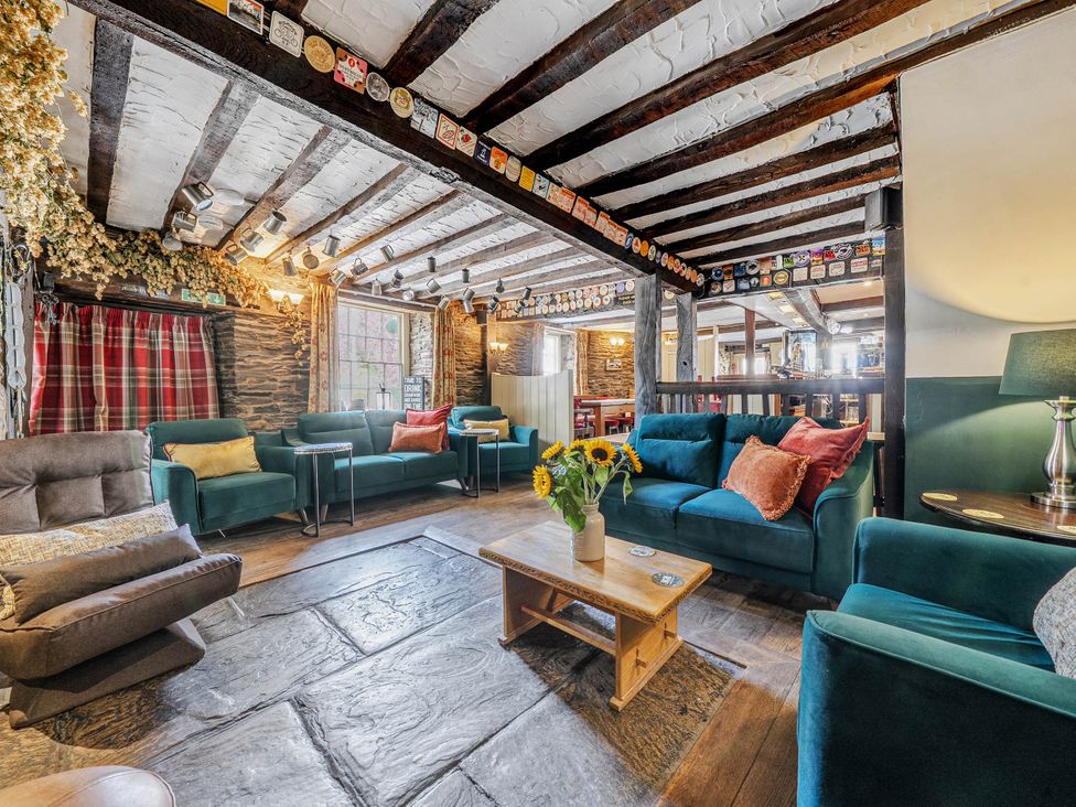 A snug with comfortable seating and a coffee table at The Boars Head Pub in Bishop's Castle