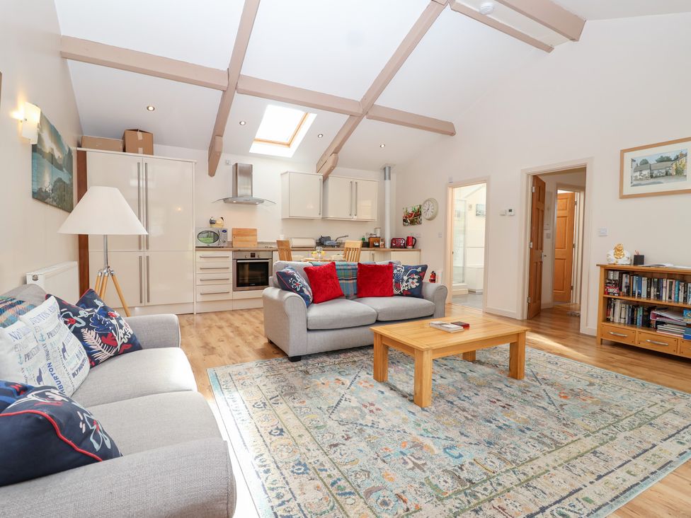 A living room with a sofa and coffee table at Tregona Buckland Monachorum near Yelverton