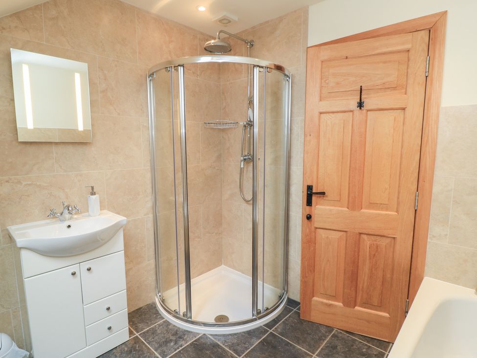 A bathroom with a shower and sink at Bramble Cottage in Babcary near Lydford-On-Fosse