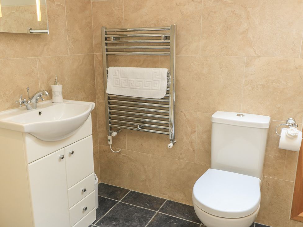A bathroom with a sink and toilet at Badger Cottage in Babcary near Lydford-On-Fosse