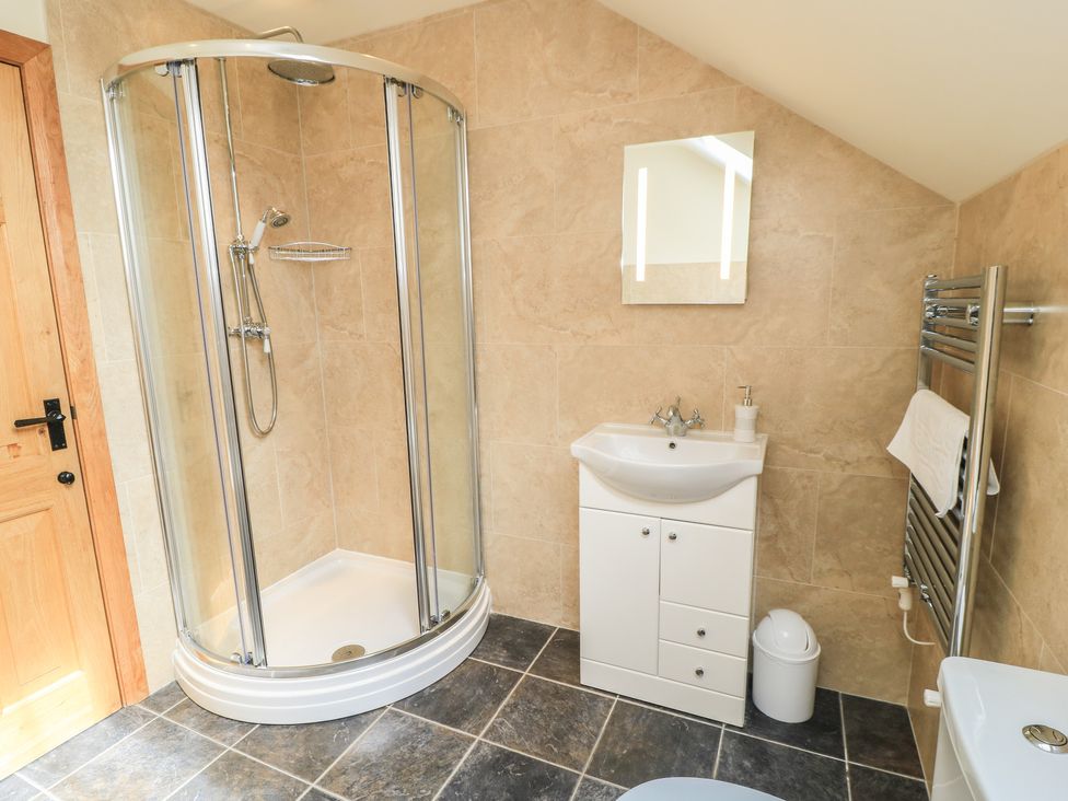 A bathroom with a shower and sink at Badger Cottage in Babcary near Lydford-On-Fosse
