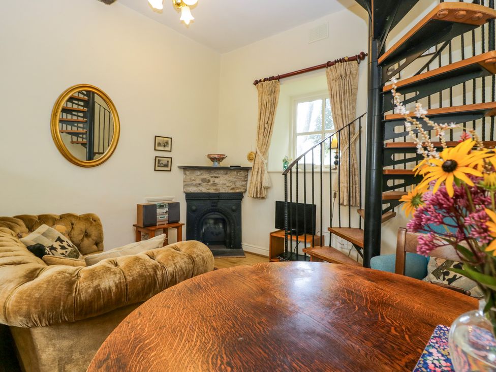 A living room with a sofa and a coffee table at Longlands Milkmaid's Parlour Cartmel near Grange-over-Sands