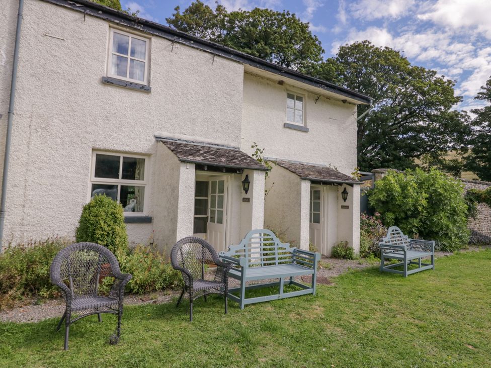 A house with seating in a garden at Longlands Milkmaid's Parlour Cartmel near Grange-over-Sands