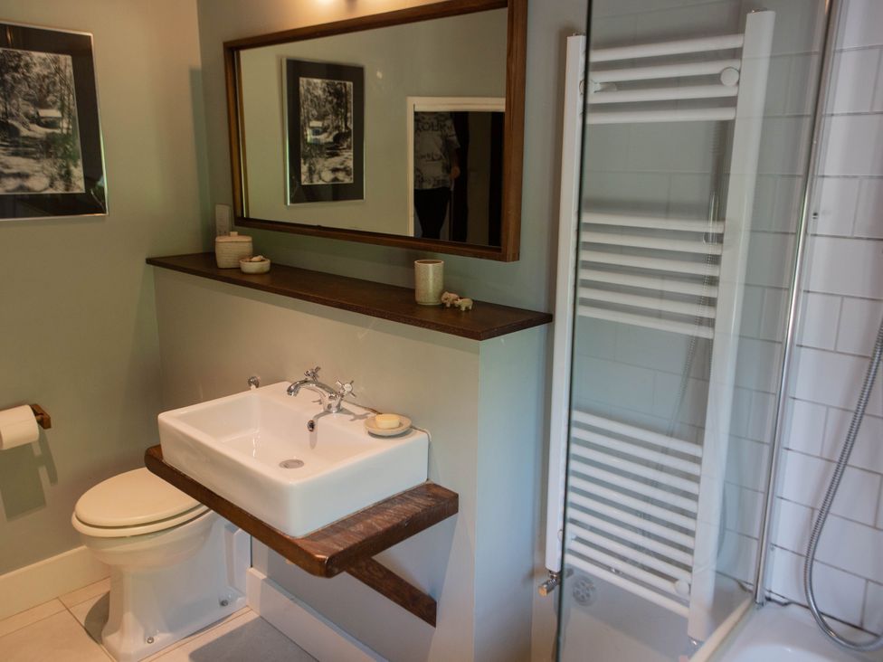 A bathroom with a sink and shower at Newstead Farmhouse East Chiltington near Lewes, Sussex