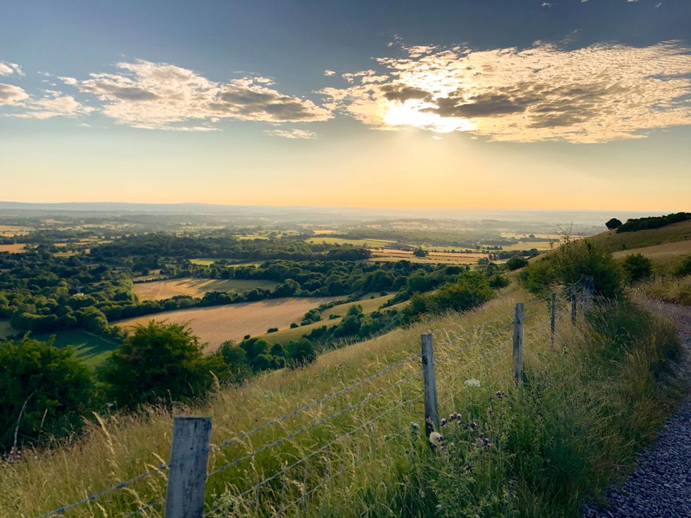 A landscape view with fields and hills at Newstead Farmhouse in East Chiltington near Lewes, Sussex