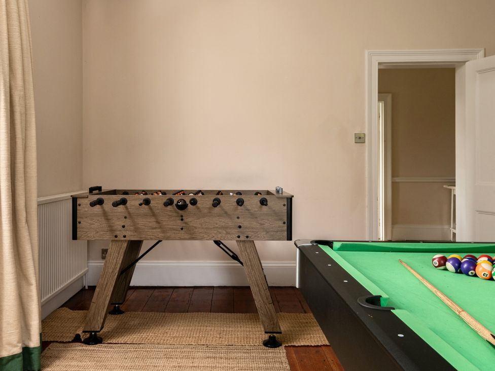 A game room with a foosball table and pool table at The Downwood in Blandford Forum