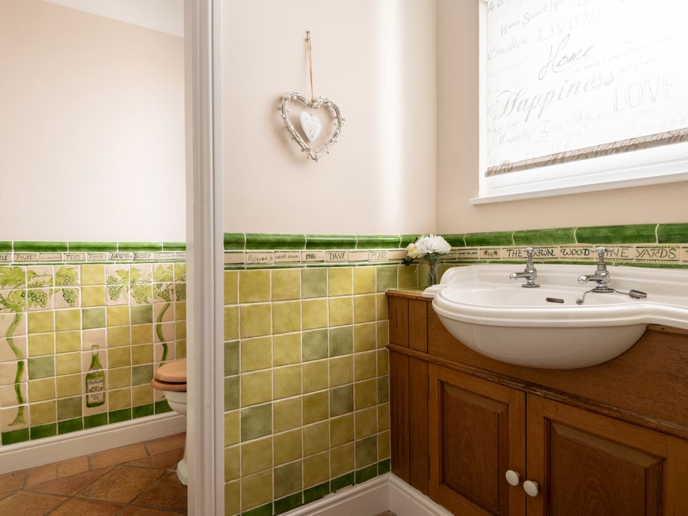 A bathroom with a sink and toilet at The Downwood in Blandford Forum