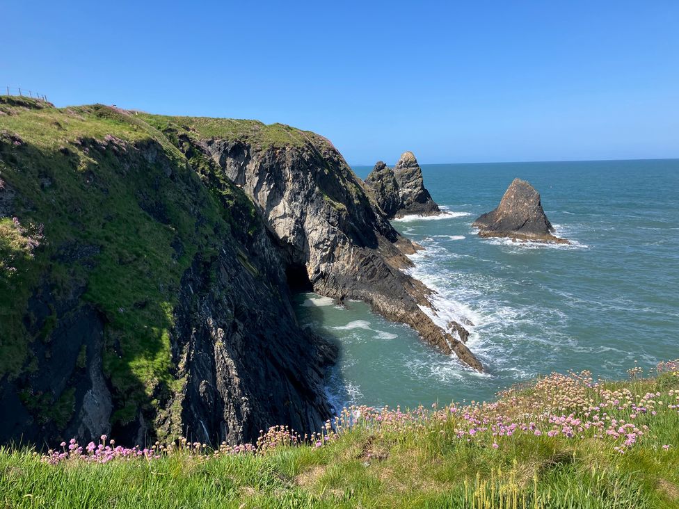 A coastal view with cliffs and ocean at West End Cottage in Newport, Pembrokeshire