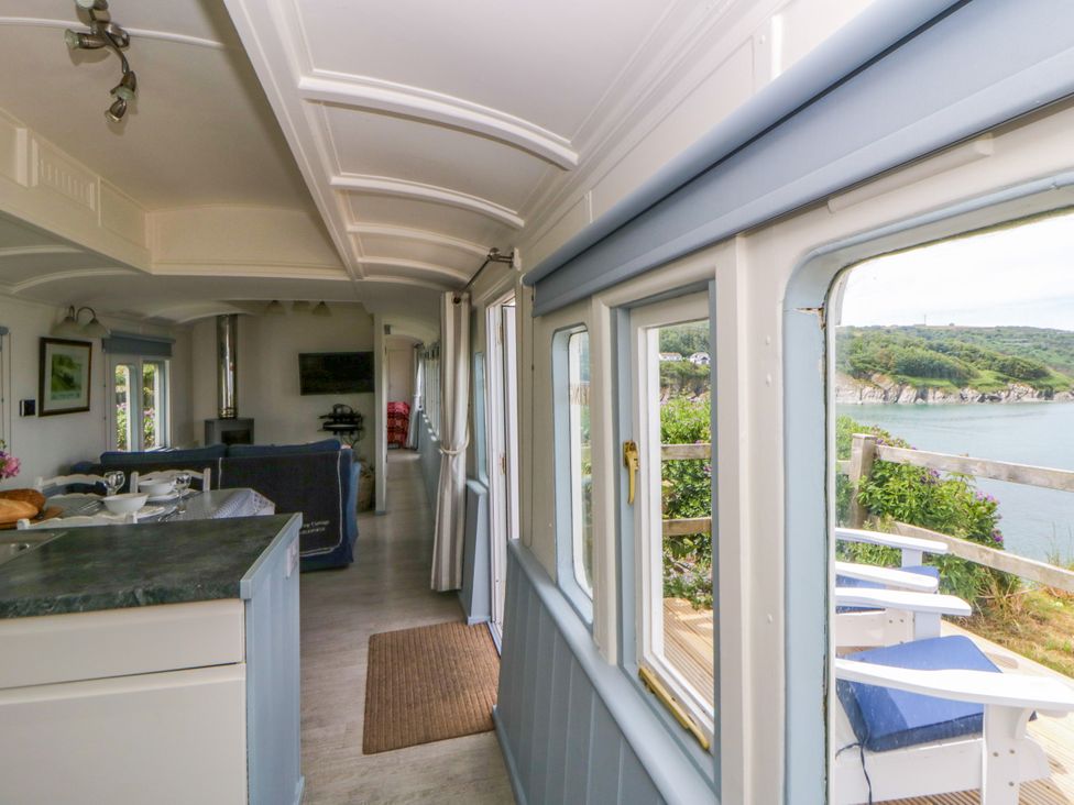 A living room with a view of the sea at Clifftop Carriage in Aberporth, Ceredigion
