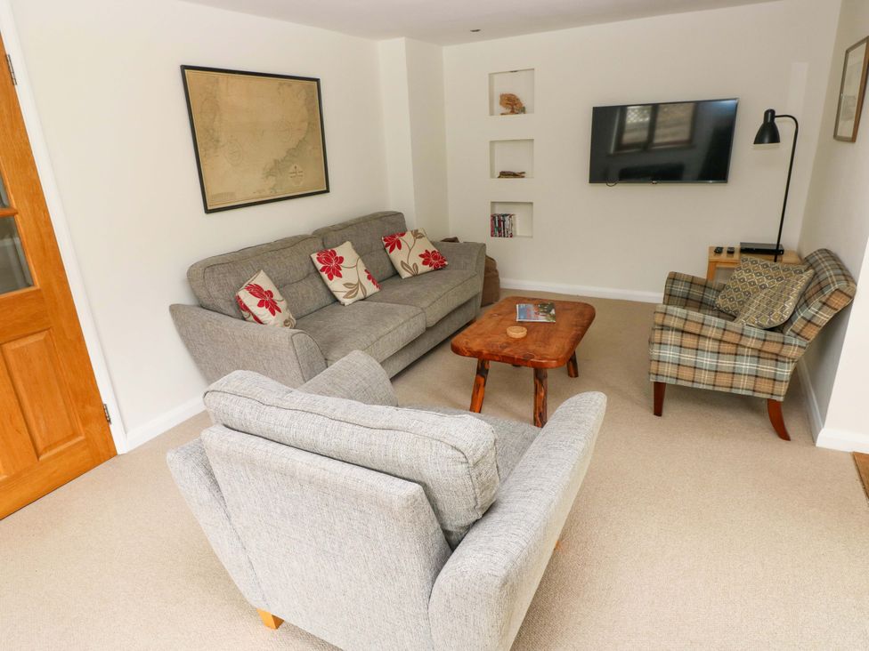 Living room with seating and a television at Brynawelon in Newport, Pembrokeshire