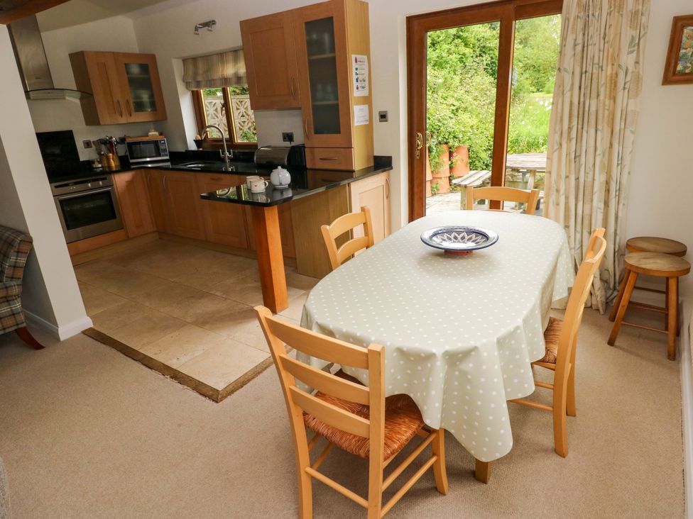 A kitchen with a dining area at Brynawelon in Newport, Pembrokeshire