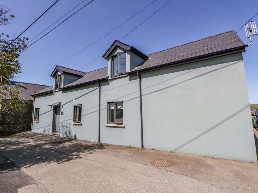 A house with multiple windows and a door at The Willows in Newport, Pembrokeshire
