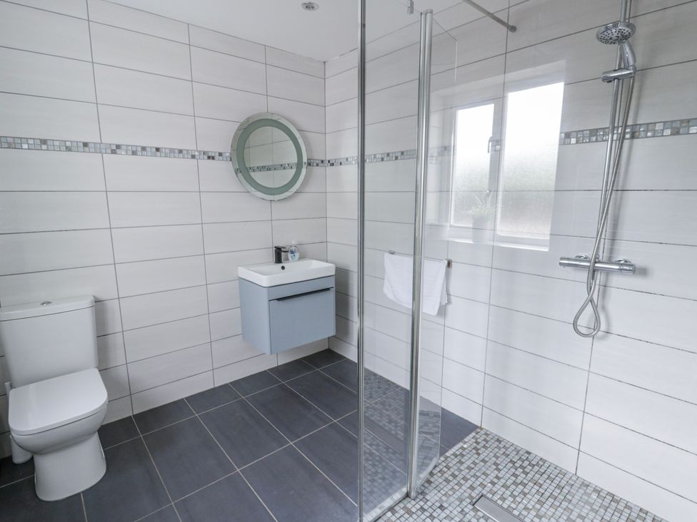 A bathroom with shower and sink at Y Felin in Cardigan, Ceredigion