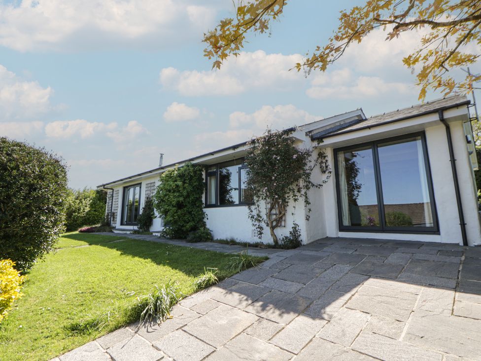 An exterior view of a house with landscaped garden at Dolwylan, Newport, Pembrokeshire