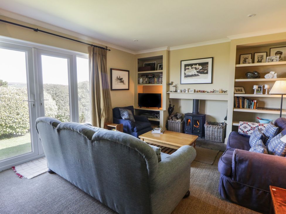 A living room with a coffee table and sofa at Dolwylan in Newport, Pembrokeshire