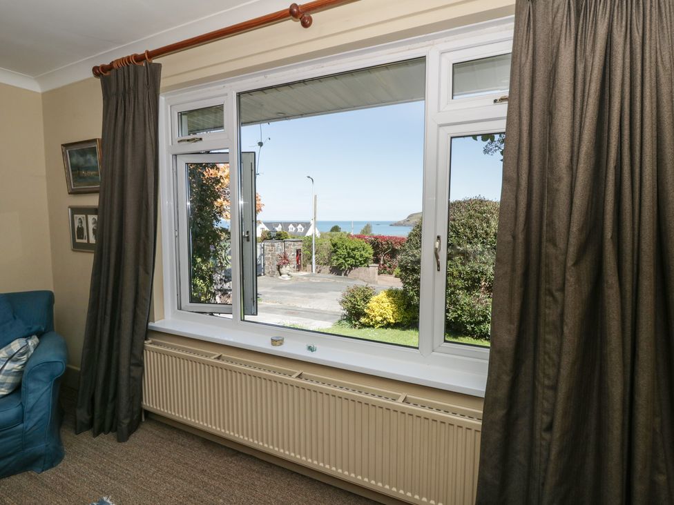 A living room with a view of the sea at Dolwylan Newport, Pembrokeshire