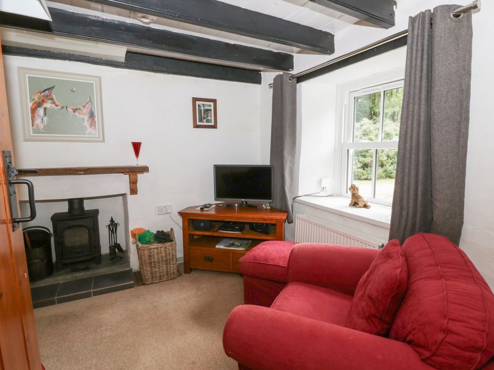 A snug with a television and sofa at Panteg, Cardigan Llangoedmor Cardigan