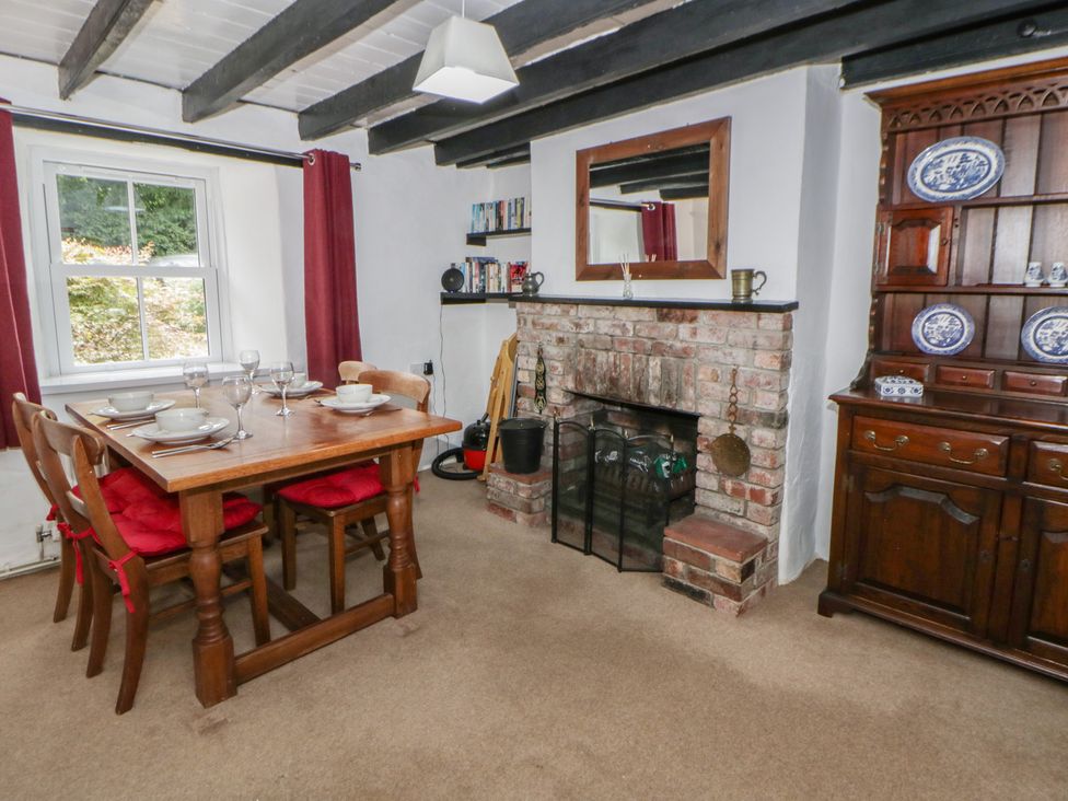 A dining room with a table and chairs at Panteg, Cardigan Llangoedmor Cardigan
