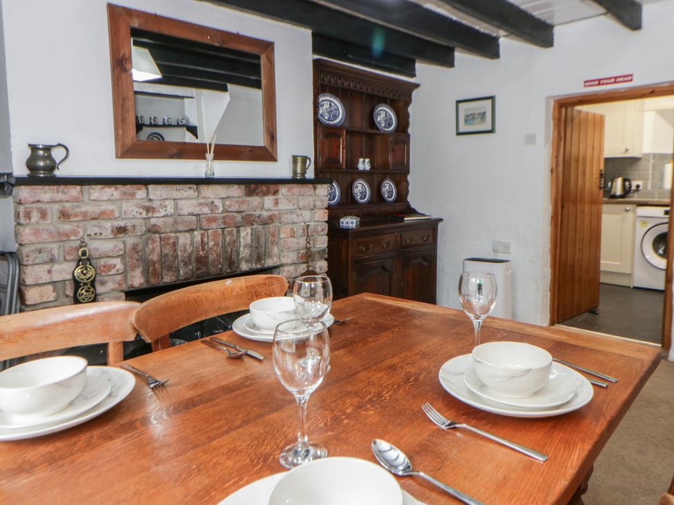 A dining room with a table set for dinner at Panteg, Cardigan Llangoedmor Cardigan