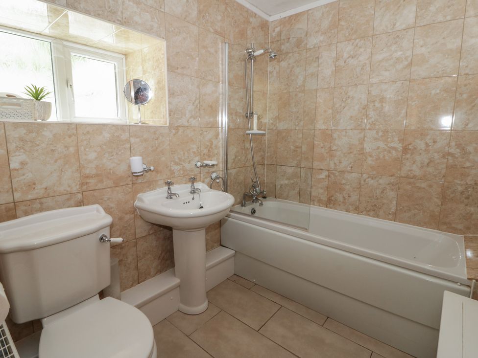 A bathroom with a bath, sink and toilet at Panteg, Cardigan Llangoedmor Cardigan