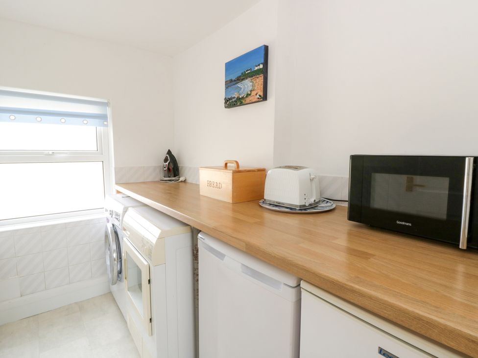 A kitchen with appliances on a countertop at Beach Retreat Aberporth