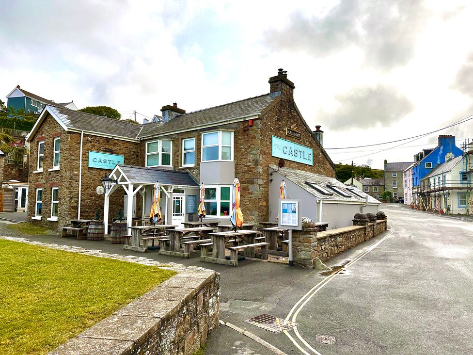 A pub with outdoor seating at The Castle in Little Haven, Pembrokeshire