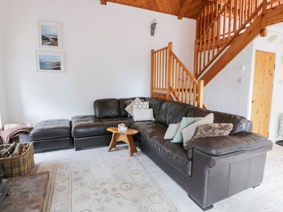 A living room with a sofa and coffee table at The Barn in Rockcliffe